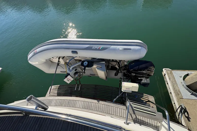 Slide: The Image of Inflatable boat with Tohatsu motor on 1995 Grand Banks 42 Motoryacht. - 17