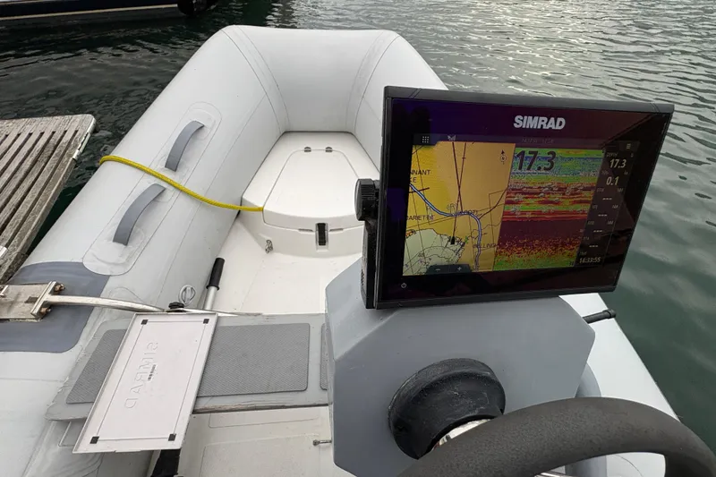 Slide: The Image of Inflatable boat with Simrad navigation system, docked beside water. Grand Banks 42 Motoryacht, 1995. - 21