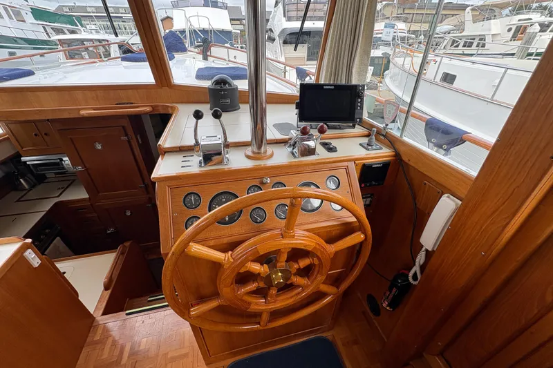 Slide: The Image of Helm with wooden wheel and navigation instruments. - 23