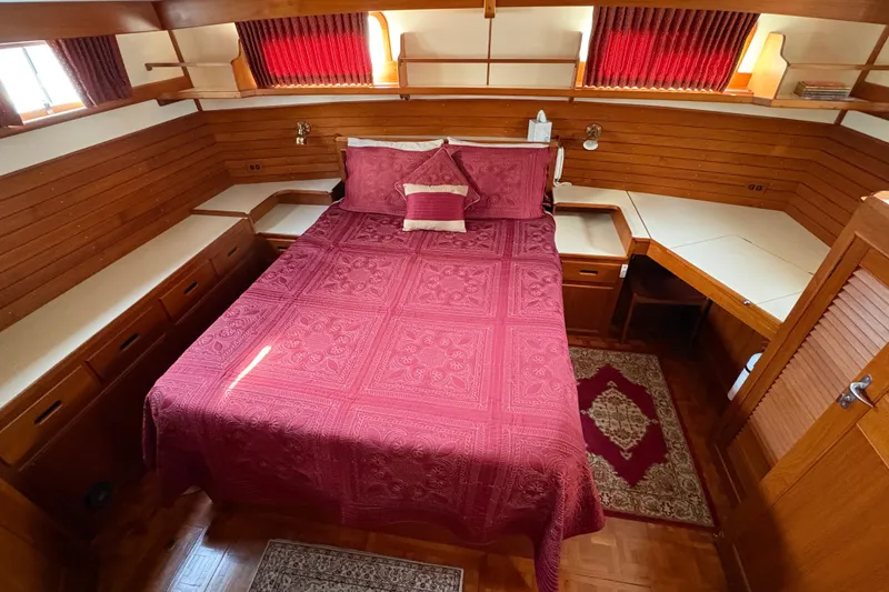 Slide: The Image of Luxurious cabin interior of 1995 Grand Banks 42 Motoryacht with bedding and lots of storage - 35