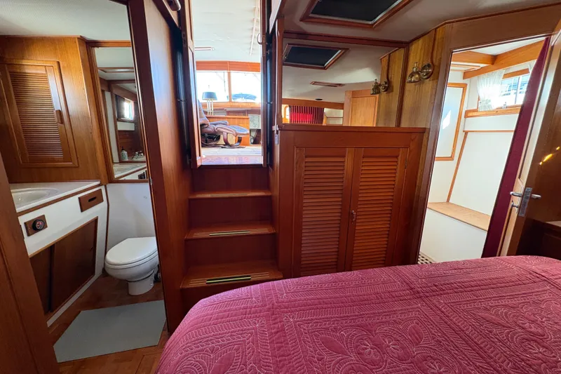 Slide: The Image of Interior of 1995 Grand Banks 42 Motoryacht with wood paneling and cozy furnishings. - 40