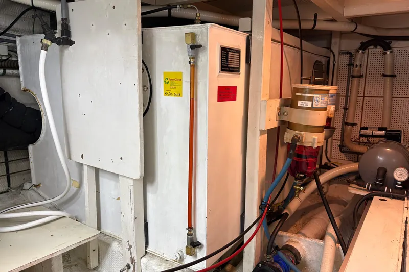 Slide: The Image of Engine room of 1995 Grand Banks 42 Motoryacht with fuel system components. - 48