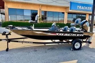 The Image of 2020 Tracker Pro Team 175 TXW boat on trailer outside dealership. - 0