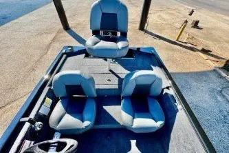 Slide: The Image of 2020 Tracker Pro Team 175 TXW fishing boat with spacious deck and seating. - 2