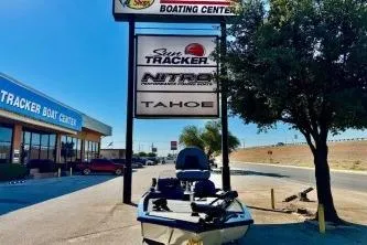 Slide: The Image of 2020 Tracker Pro Team 175 TXW boat interior with steering wheel and Lowrance electronics. - 4