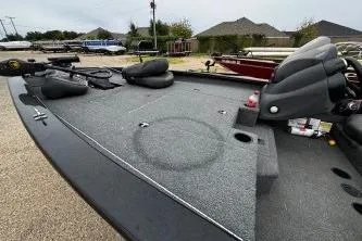 Slide: The Image of 2020 Tracker Pro Team 175 TXW boat interior with steering console and seating. - 5