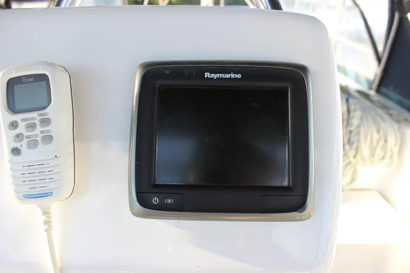 Slide: The Image of Raymarine display and Icom radio on 2014 Hunter 33 yacht dashboard. - 24