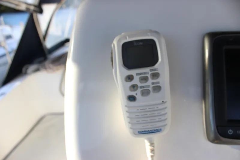 Slide: The Image of VHF radio on 2014 Hunter 33 sailboat dashboard, close-up view. - 27