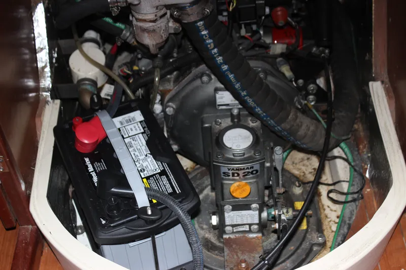 Slide: The Image of Engine compartment of a 2014 Hunter 33 sailboat with Yanmar SD20 engine and battery. - 38