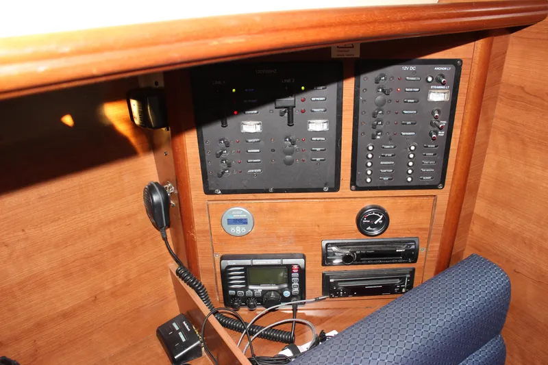 Slide: The Image of Control panel of a 2014 Hunter 33 sailboat with navigation and communication equipment. - 45