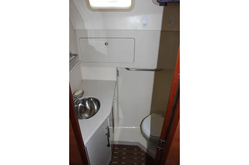 Slide: The Image of Compact bathroom in 2014 Hunter 33 sailboat with sink and toilet. - 57