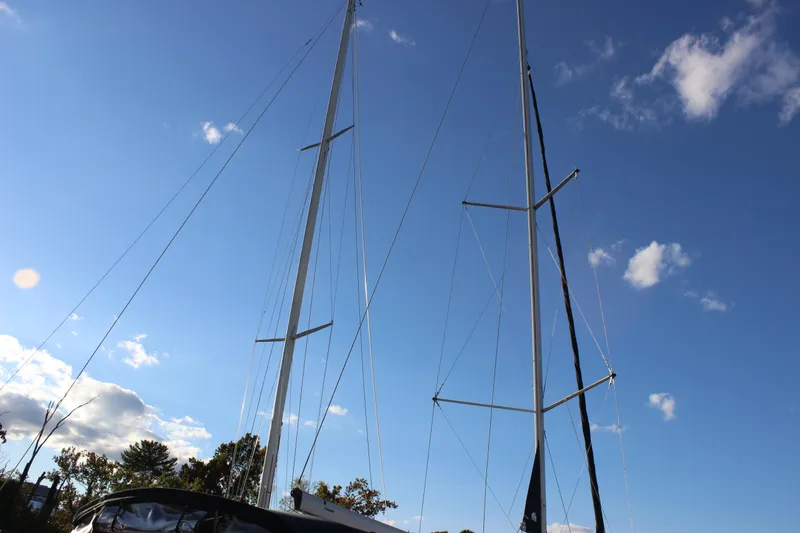 Slide: The Image of Sailboat masts against a clear blue sky, Hunter 33 model, 2014. - 7