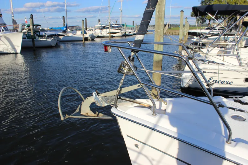 Slide: The Image of Sailboats docked at marina, featuring a 2014 Hunter 33 in the foreground. - 9