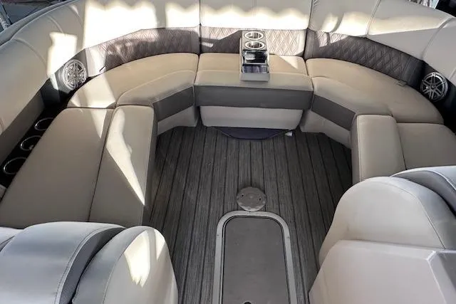 Slide: The Image of Luxurious seating area on 2021 Harris Solstice 230 boat with cup holders and speakers. - 10