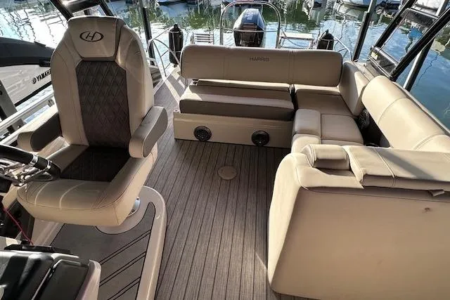 Slide: The Image of Luxurious interior of 2021 Harris Solstice 230 boat with plush seating and elegant design. - 11