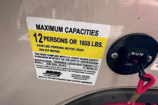 Slide: The Image of Maximum capacity label on 2021 Harris Solstice 230 boat, 12 persons or 1655 lbs. - 15