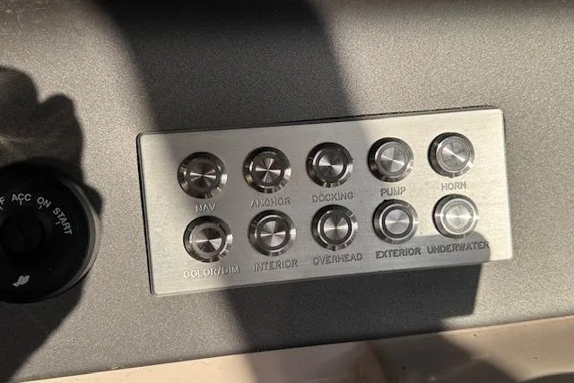 Slide: The Image of Control panel of a 2021 Harris Solstice 230 boat with labeled buttons. - 17