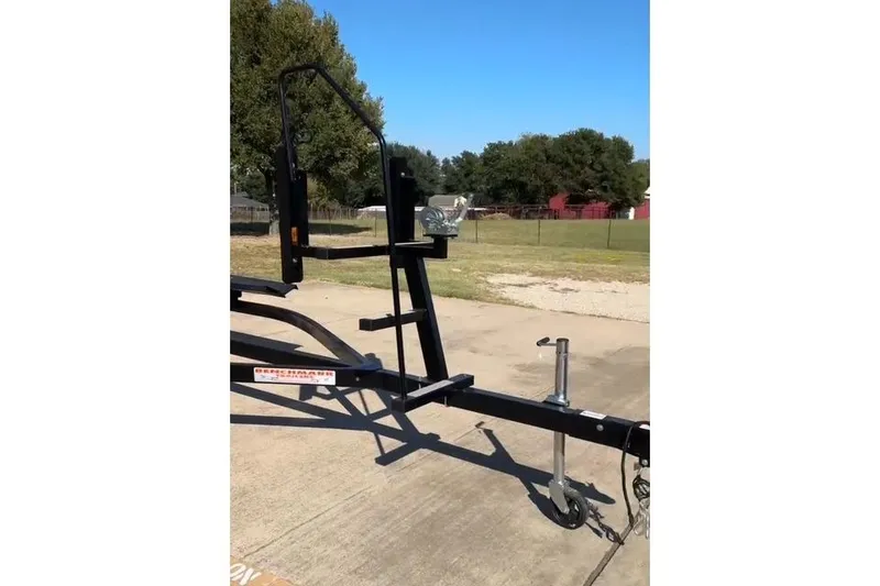 Slide: The Image of Trailer for 2021 Harris Solstice 230 boat on concrete driveway. - 21