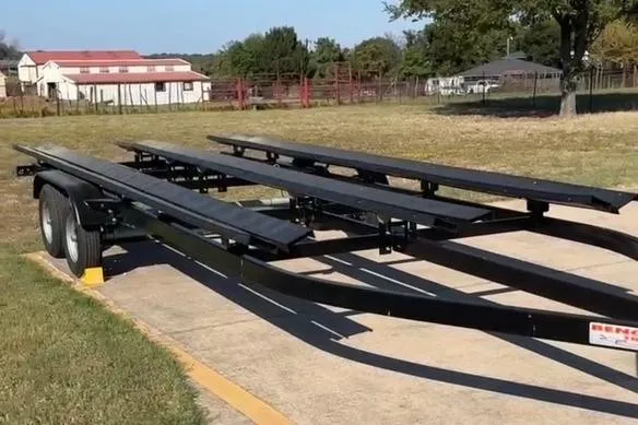 Slide: The Image of 2021 Harris Solstice 230 boat trailer parked on a sunny driveway. - 23