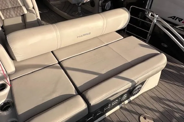 Slide: The Image of 2021 Harris Solstice 230 boat interior with beige seating and cup holders. - 7