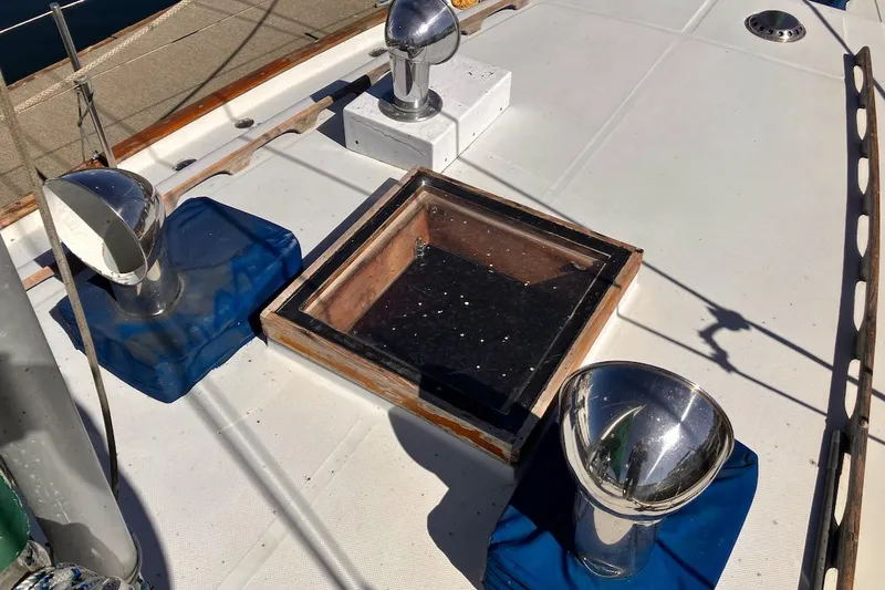 Slide: The Image of 1981 Valiant Cutter deck with vents and hatch, showcasing nautical design elements. - 19