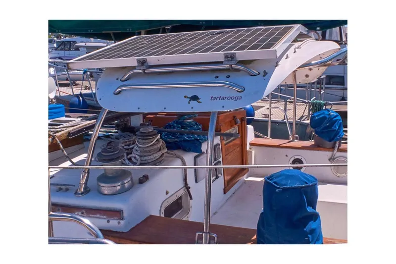 Slide: The Image of 1981 Valiant Cutter sailboat with solar panel and nautical equipment on deck. - 24