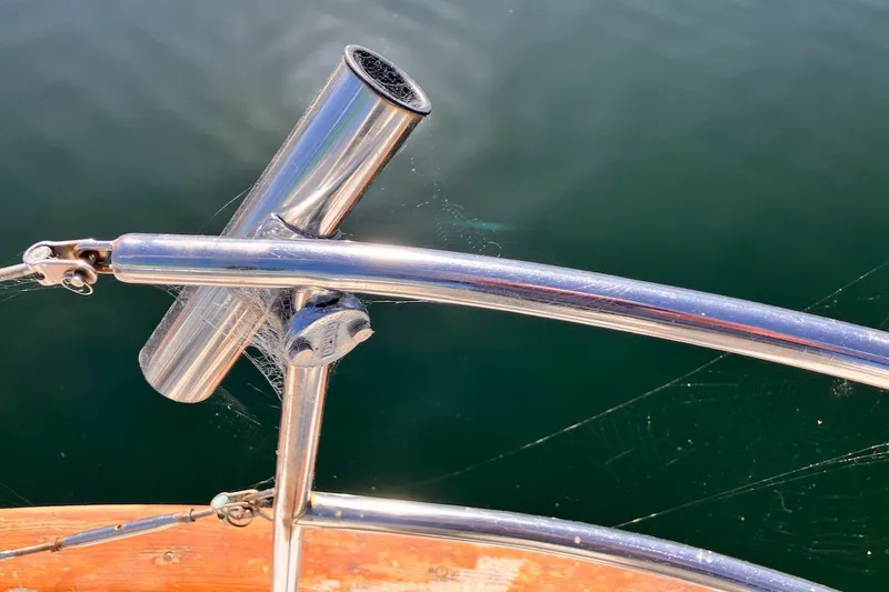 Slide: The Image of Stainless steel railing on 1981 Valiant Cutter boat with visible cobwebs. - 31