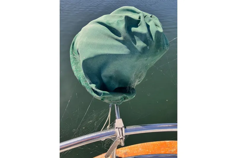 Slide: The Image of Green cover on 1981 Valiant Cutter boat railing with spider webs. - 35