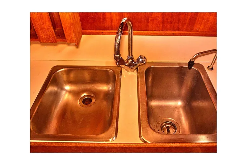 Slide: The Image of 1981 Valiant Cutter kitchen sink with dual basins and chrome faucet. - 61