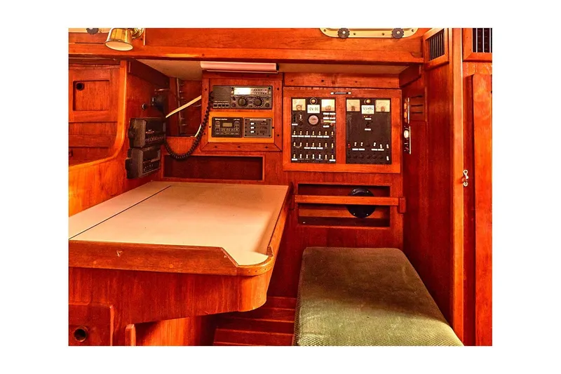 Slide: The Image of 1981 Valiant Cutter interior with navigation equipment and wooden cabinetry. - 71