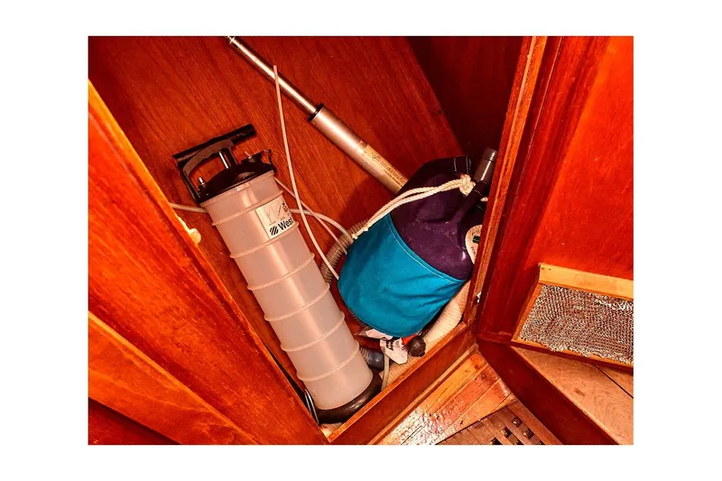 Slide: The Image of 1981 Valiant Cutter interior storage with pump and blue bag. - 83
