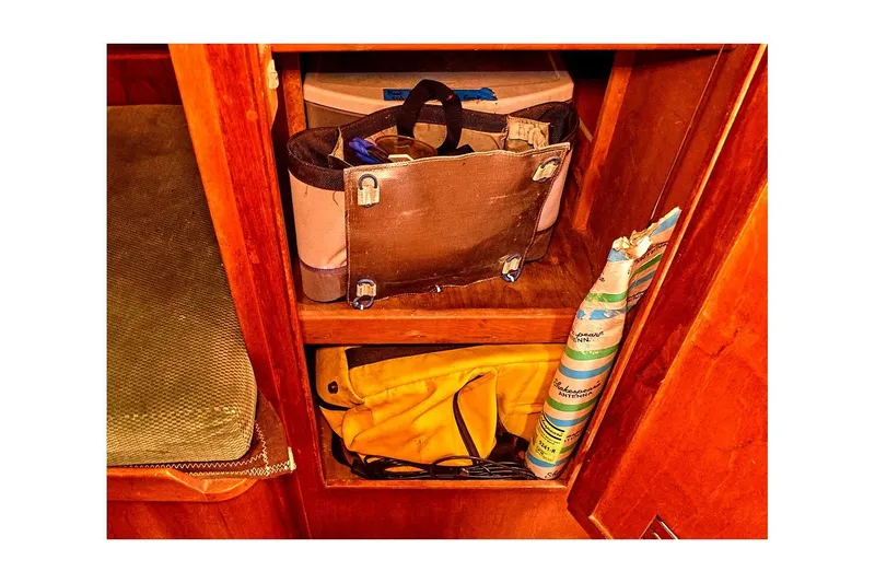 Slide: The Image of Storage compartment in 1981 Valiant Cutter with tools and equipment. - 84