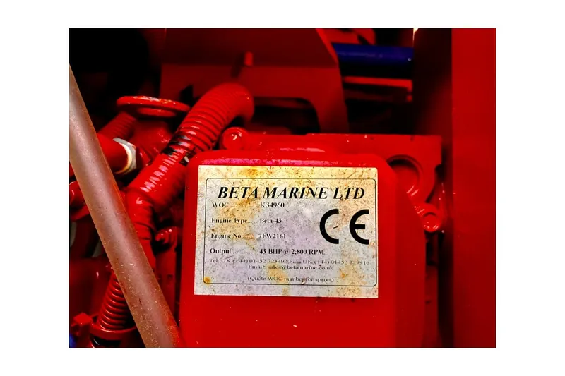 Slide: The Image of Red Beta Marine engine label on a 1981 Valiant Cutter. - 89