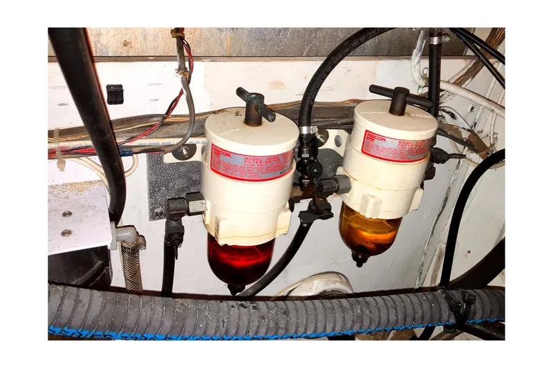 Slide: The Image of Engine compartment of 1981 Valiant Cutter with dual fuel filters and wiring. - 90