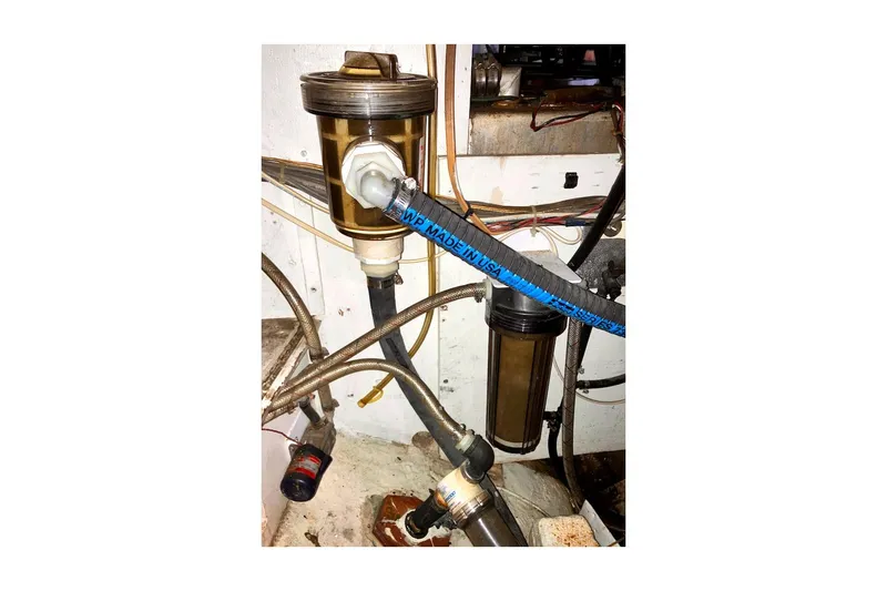 Slide: The Image of Engine compartment of 1981 Valiant Cutter with fuel filters and hoses visible. - 91