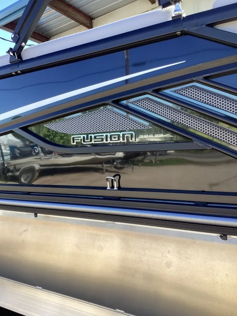 Slide: The Image of SunCatcher Fusion 324SS 2026 boat with sleek design. - 12