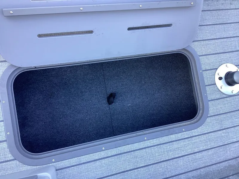 Slide: The Image of Storage compartment in SunCatcher Fusion 324SS boat, model 2026. - 24