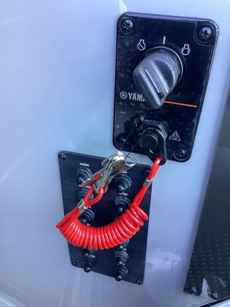Slide: The Image of Yamaha ignition switch and controls on SunCatcher Fusion 324SS, 2026 model. - 37