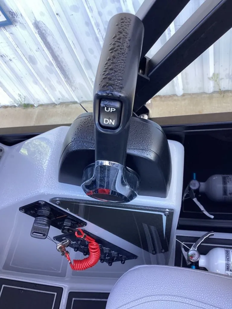 Slide: The Image of Close-up of SunCatcher Fusion 324SS boat throttle, model year 2026. - 40