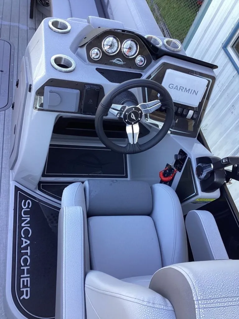 Slide: The Image of Interior view of SunCatcher Fusion 324SS 2026 with Garmin controls. - 42