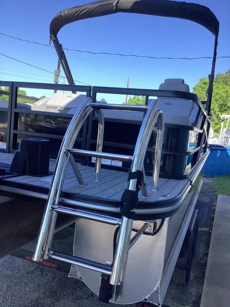 Slide: The Image of 2026 SunCatcher Fusion 324SS boat with ladder and sunshade. - 9