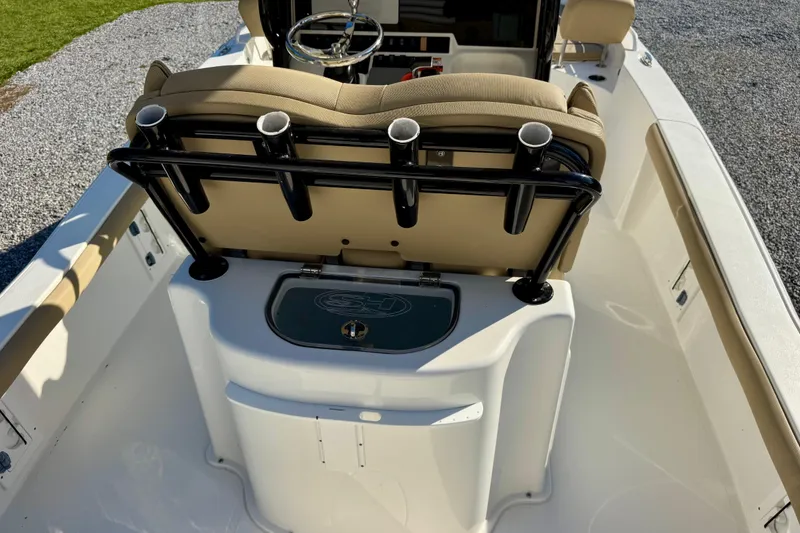 Slide: The Image of 2018 Sea Hunt BX 25 FS boat interior with seating and rod holders. - 11