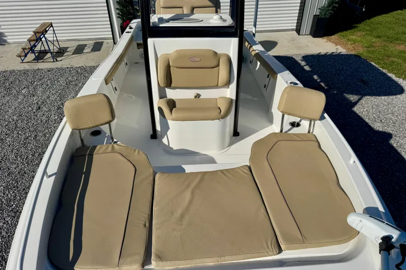 Slide: The Image of 2018 Sea Hunt BX 25 FS boat interior with beige seating and spacious layout. - 4