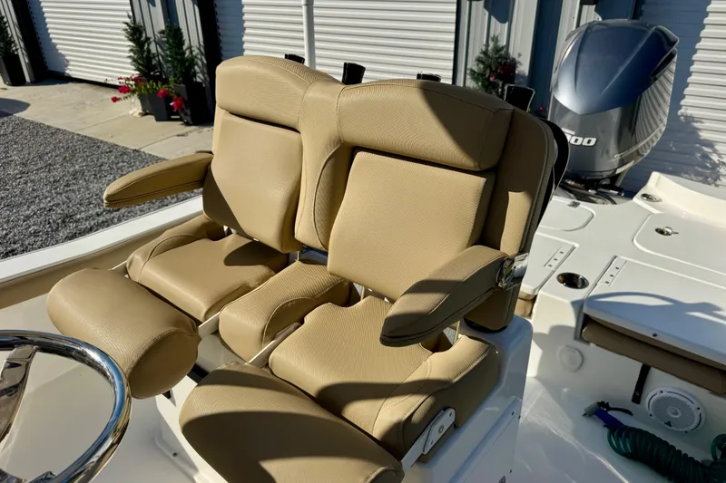 Slide: The Image of 2018 Sea Hunt BX 25 FS boat with tan cushioned seats and Yamaha outboard motor. - 8