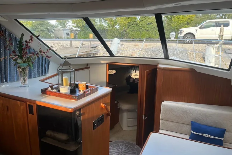 Slide: The Image of Interior of 1993 Carver 350 Aft Cabin Motor Yacht with elegant decor and large windows. - 17