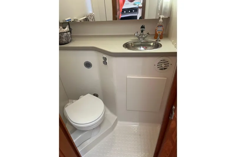 Slide: The Image of Bathroom in 1993 Carver 350 Aft Cabin Motor Yacht with sink and toilet. - 29