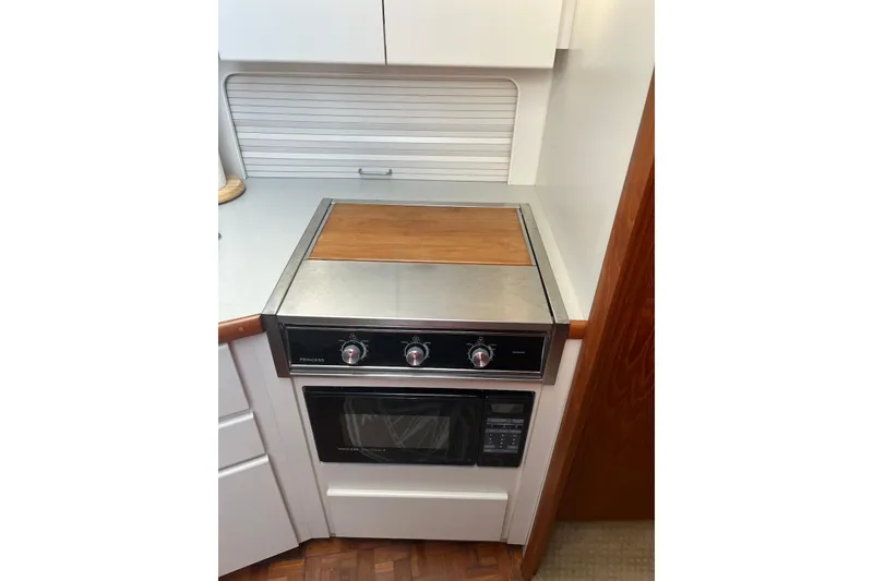 Slide: The Image of 1993 Carver 350 Aft Cabin Motor Yacht kitchen with stove and oven. - 34