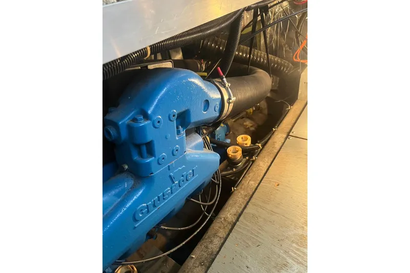 Slide: The Image of Engine compartment of 1993 Carver 350 Aft Cabin Motor Yacht with blue Crusader engine. - 35