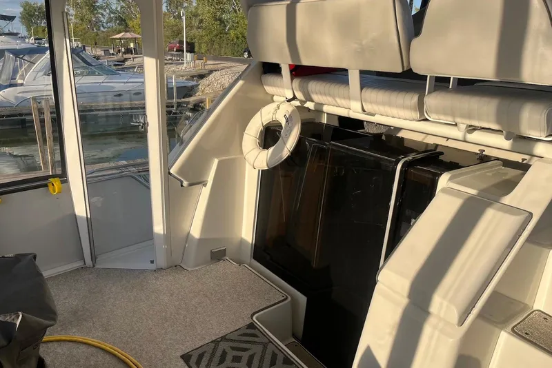 Slide: The Image of 1993 Carver 350 Aft Cabin Motor Yacht interior with seating and life preserver. - 16
