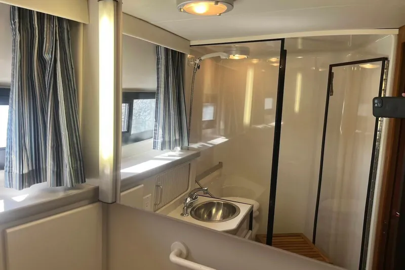 Slide: The Image of Bathroom interior of 1993 Carver 350 Aft Cabin Motor Yacht with shower and sink. - 25